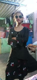 Young woman wearing sunglasses standing outdoors