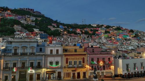 Houses in town against sky