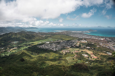 Aerial view of city and sea against sky