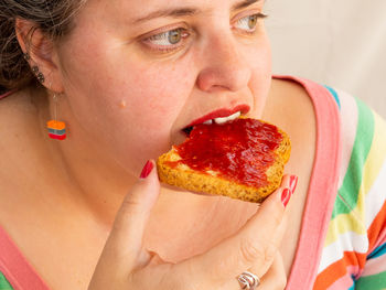 Close-up portrait of woman eating ice cream
