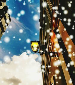 Low angle view of illuminated building against sky at night