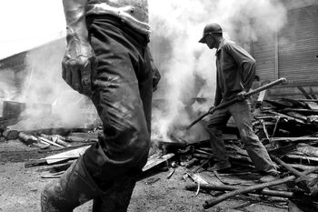 MAN WORKING AT CONSTRUCTION SITE