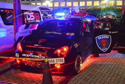 Cars on street in city at night