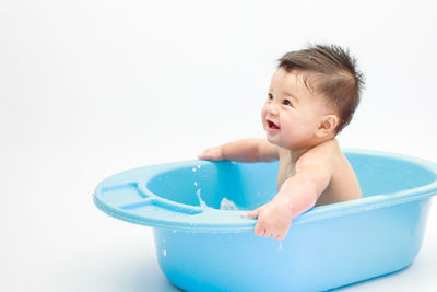 Boy playing in bathroom