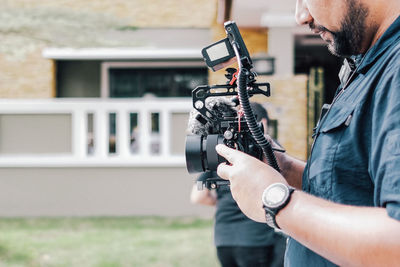 Side view of man photographing