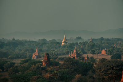 Panoramic view of temple and building against sky