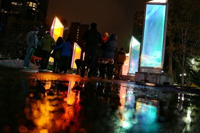 Wet illuminated city at night