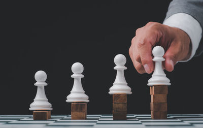 Close-up of chess pieces against white background