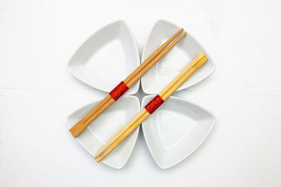 High angle view of objects on table against white background