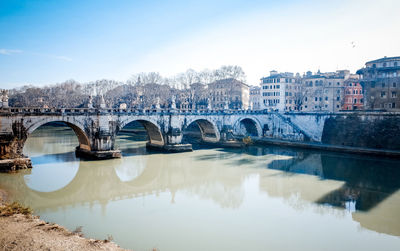 Ponte sant angelo over tiber river by residential district