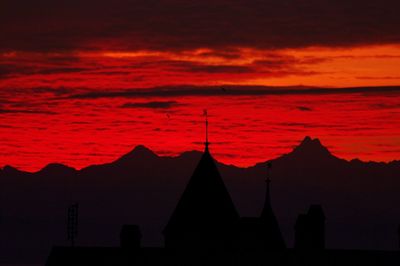 Silhouette of built structure at sunset