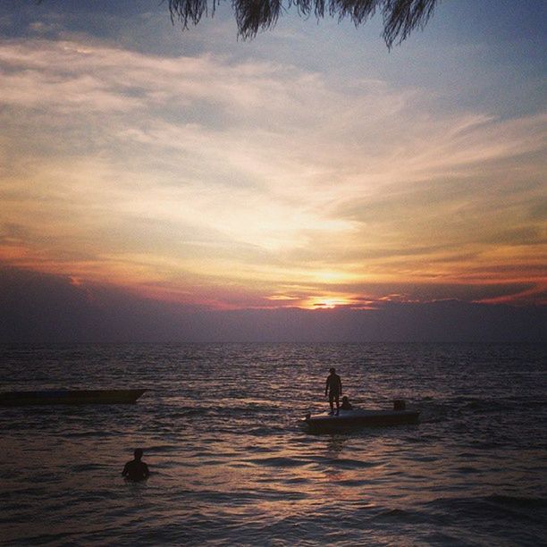 sunset, water, sea, silhouette, sky, horizon over water, orange color, scenics, beauty in nature, waterfront, men, animal themes, cloud - sky, tranquility, tranquil scene, leisure activity, one animal, nature