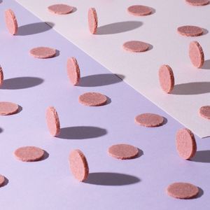 Close-up of colored pencils over white background