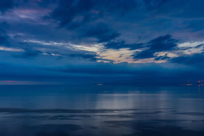 Scenic view of sea against sky at sunset