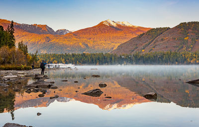 Scenic view of lake against sky during autumn