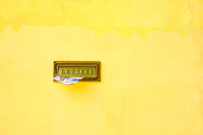 Close-up of letter in door 