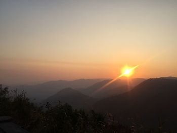 Scenic view of mountains against sky during sunset