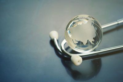 High angle view of crystal ball on glass