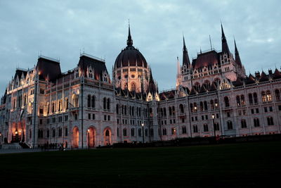 View of hungarian parliament building against cloudy sky