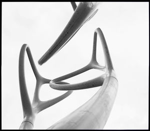 Low angle view of metallic structure against sky