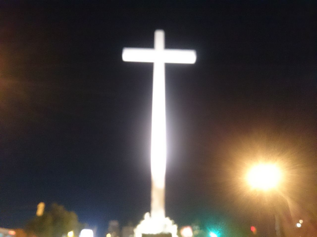 VIEW OF CROSS AT NIGHT