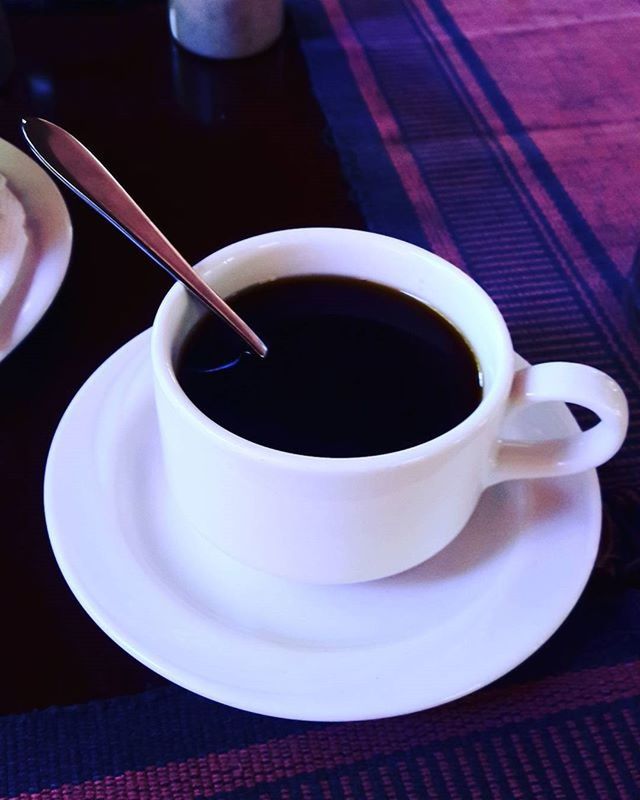 coffee cup, drink, food and drink, refreshment, saucer, coffee - drink, indoors, freshness, table, cup, coffee, spoon, still life, tea cup, high angle view, beverage, tea, close-up, frothy drink, cappuccino