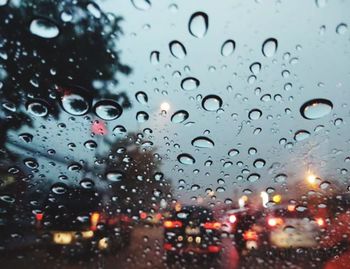 Close-up of raindrops on glass window