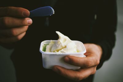 Cropped hand holding ice cream