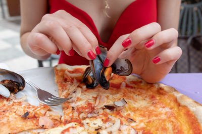 Midsection of woman holding ice cream