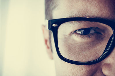 Close-up portrait of man wearing eyeglasses 