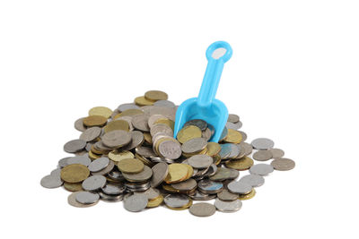 Close-up of coins on white background