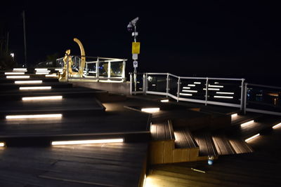 View of pier at night