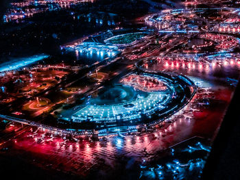 High angle view of illuminated city buildings at night