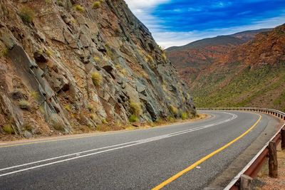 Empty road passing through mountains