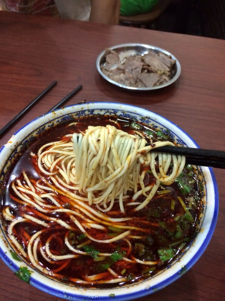 indoors, food and drink, table, freshness, still life, bowl, high angle view, directly above, close-up, food, healthy eating, plate, spoon, noodles, no people, ready-to-eat, serving size, creativity, drink, wood - material