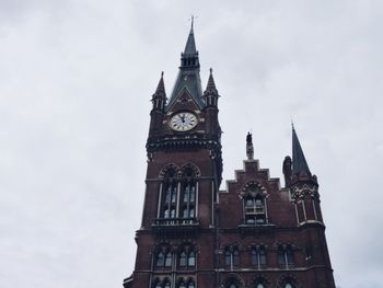 Low angle view of clock tower against sky