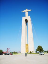 Low angle view of statue against blue sky