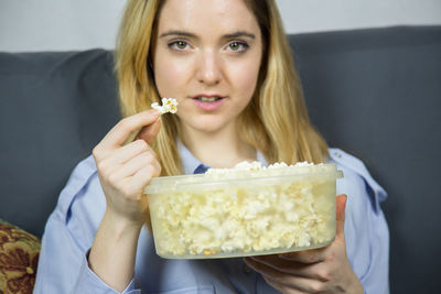Portrait of woman eating food