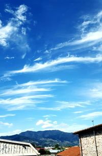 Scenic view of mountains against cloudy sky