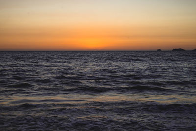 Scenic view of sea at sunset