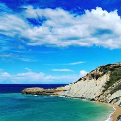 Scenic view of sea against cloudy sky