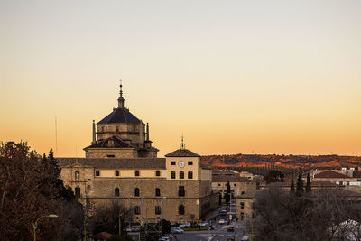 View of buildings at sunset