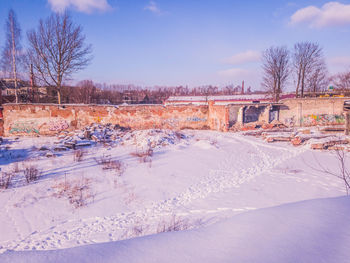 Snow covered landscape against sky