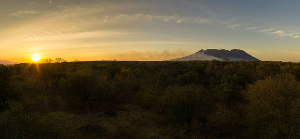 Scenic view of landscape against sky during sunset