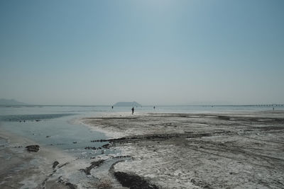 Scenic view of beach against clear sky