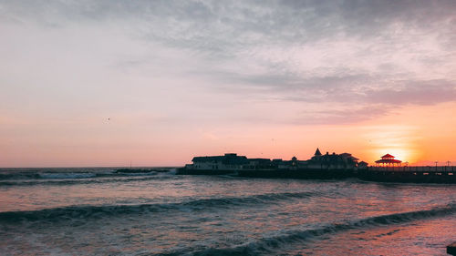 Scenic view of sea at sunset