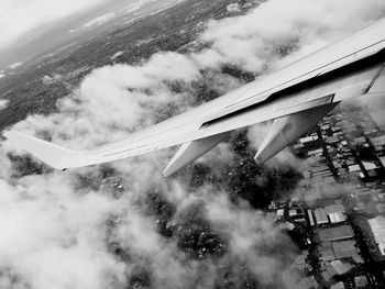 Airplane wing against sky