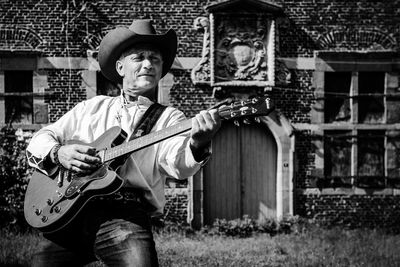 Portrait of man playing guitar