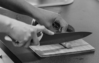 Close-up of person working on cutting board