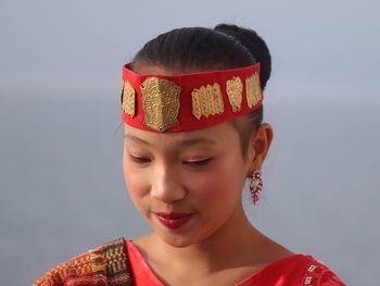 Close-up of woman wearing headband outdoors